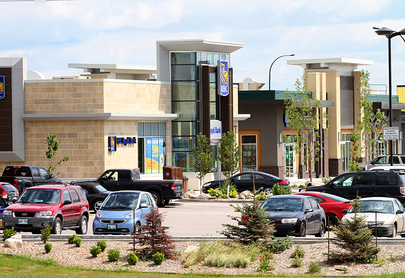 Sage Creek Village Centre parking lot with shops and services