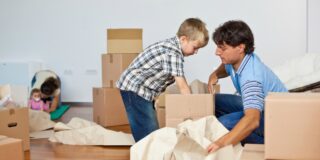Man and son packing boxes