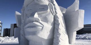 Festival du Voyageur Ice Sculpture of man with snow glasses