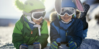 Happy kids skiing