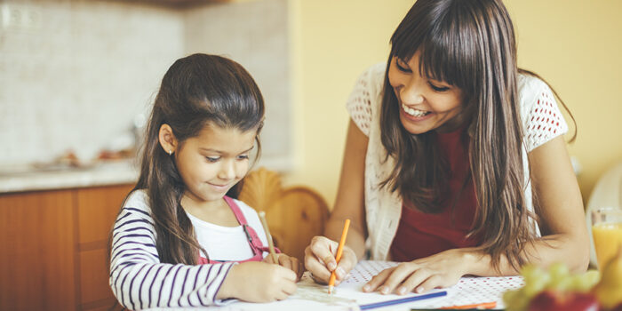 Mother and daughter drawing together