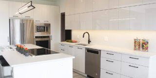Contemporary kitchen with glossy white cabinets - 44 West Plains Drive in Sage Creek