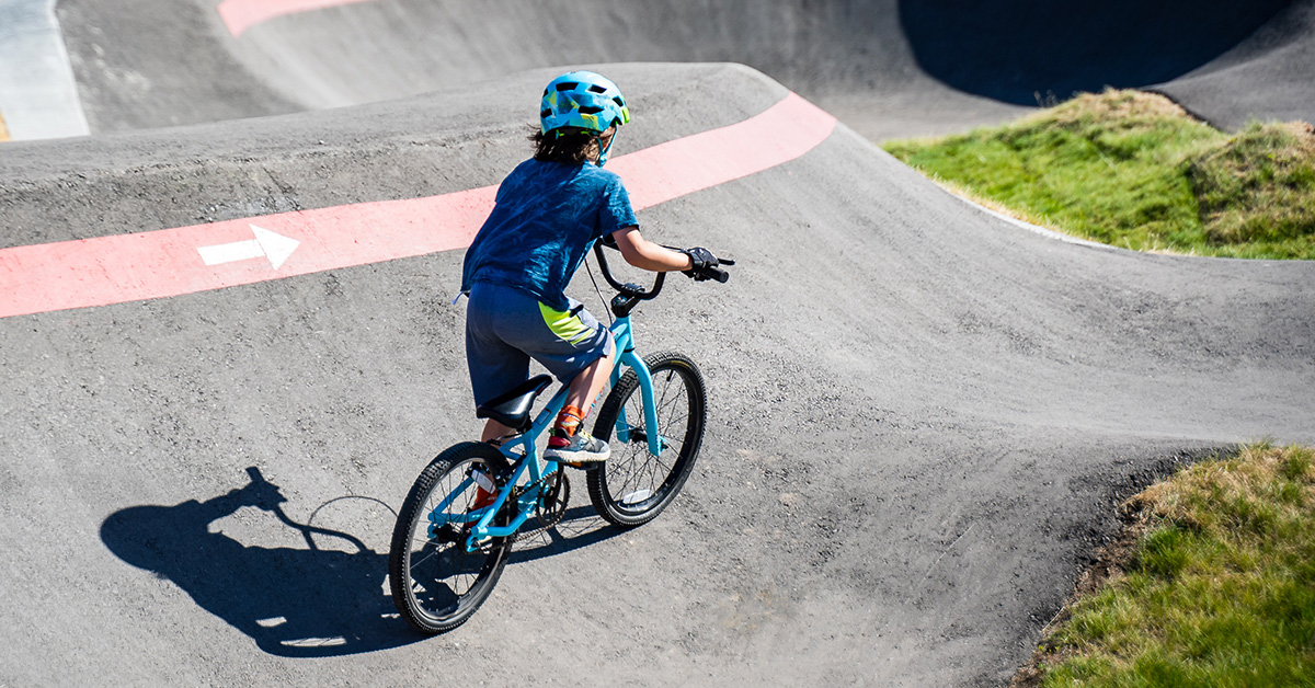 Young cyclist on pump track